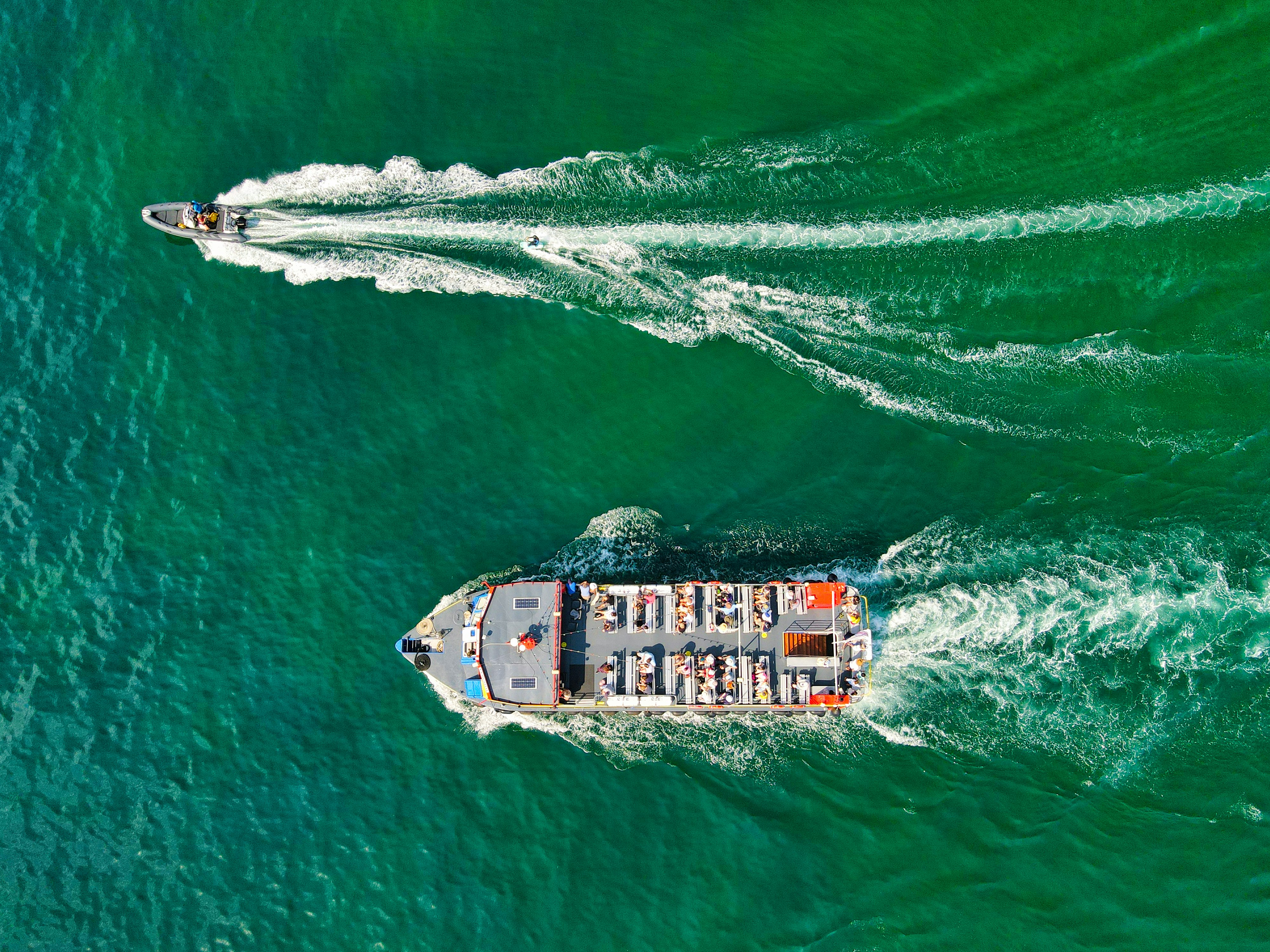 aerial view of white and brown boat on sea during daytime